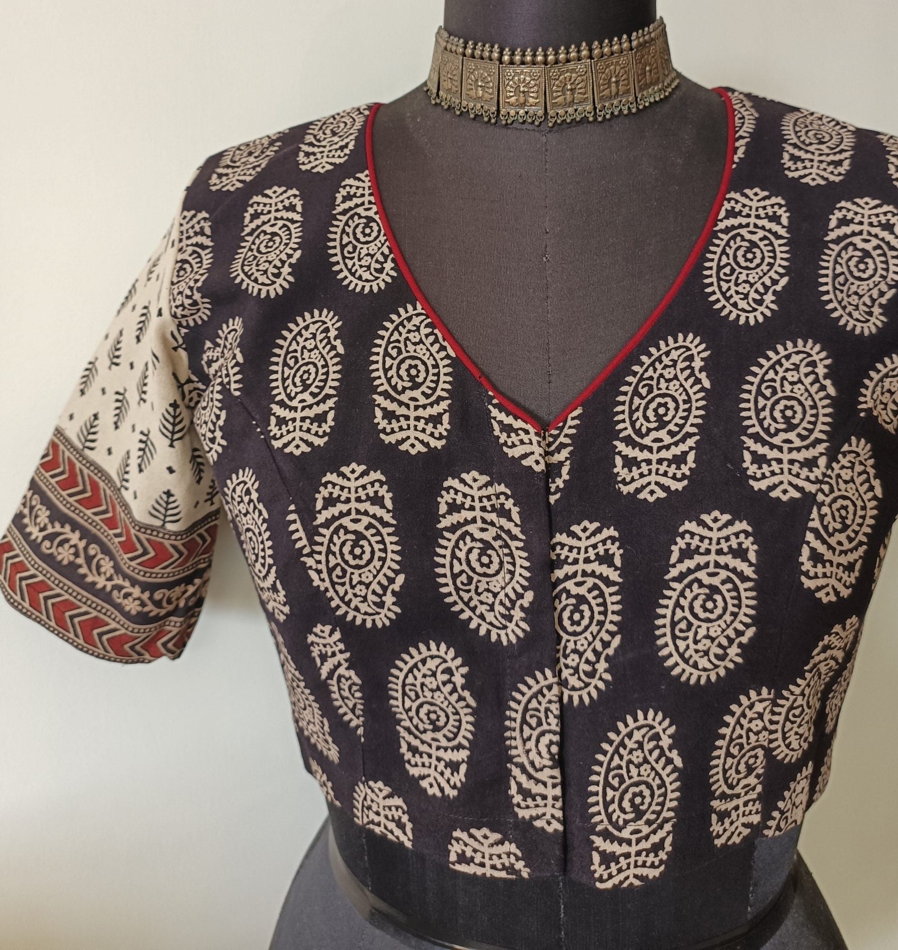 black gamathi blouse with beige sleeves