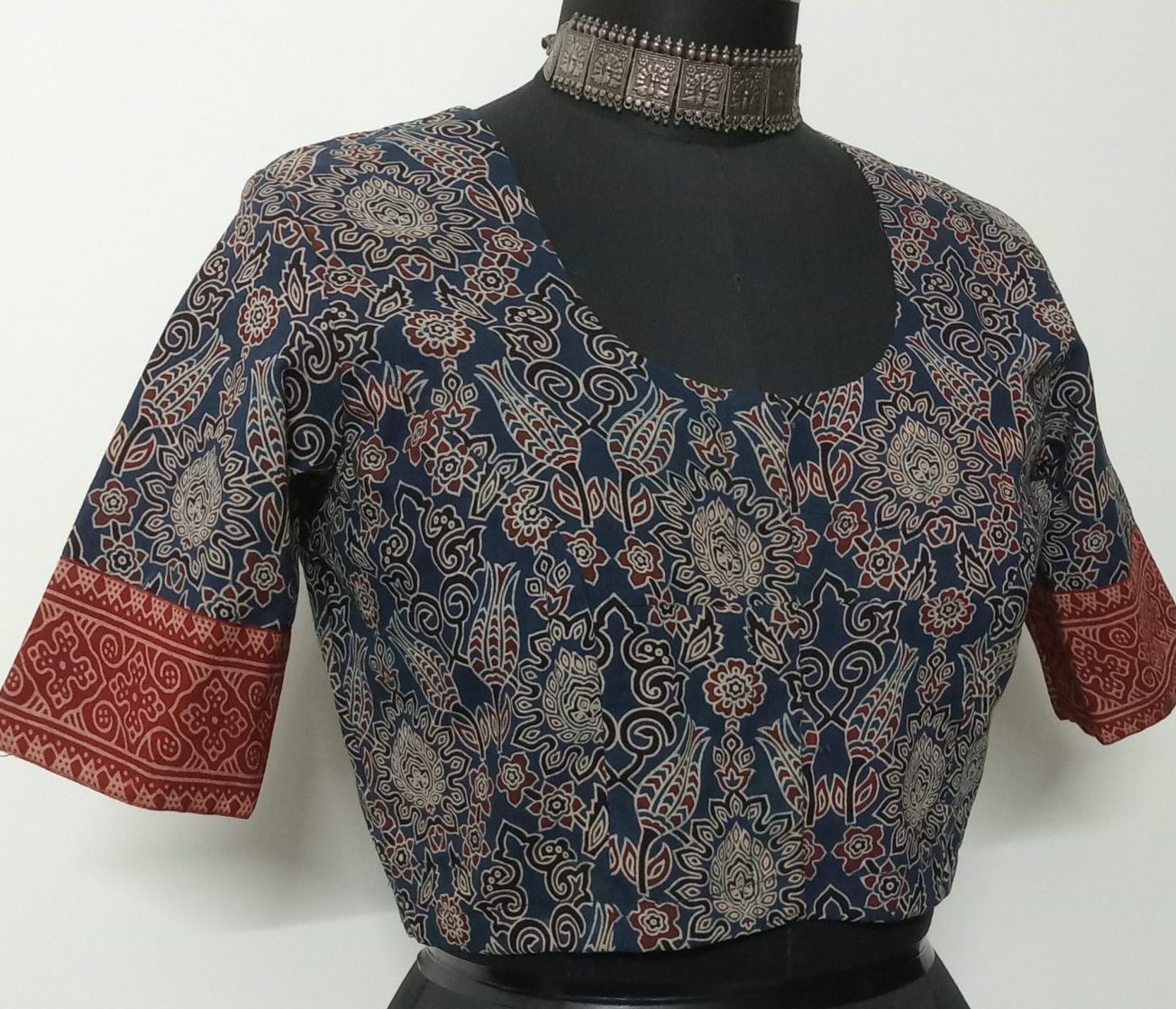 Printed indigo ajrakh blouse with maroon gamathi border sleeves