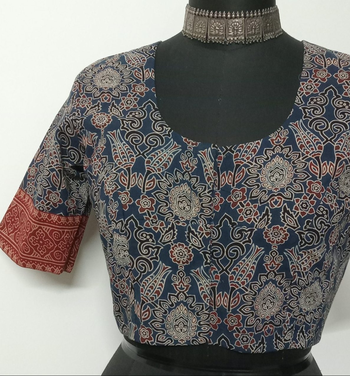 Printed indigo ajrakh blouse with maroon gamathi border sleeves